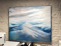 Full view of framed canvas painting mounted on wall