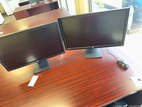 Both HP monitors side by side on desk