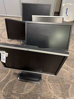 Front view of all five monitors to show screen condition and bezels