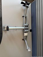 Full view of monitor arm laid on desk showing overall structure