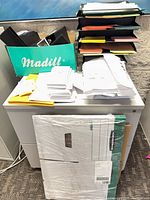 Binders in box, paper stack, mesh sorter, banker box