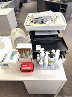 All items grouped on desktop including heater, trays, PPE, organizer