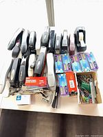 Overview of staplers, staples, tape dispenser, clips