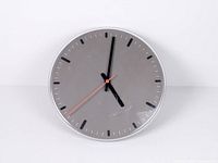 Front view showing entire clock face, hands and markers