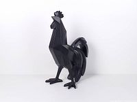 front left view of black geometric rooster sculpture