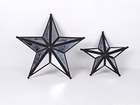 Front view of both mirrored stars standing upright