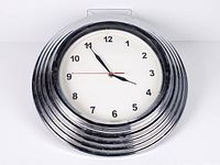 Front view of chrome neon wall clock showing full face and bezel