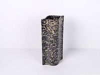 Front view showing speckled anthracite glaze and wave profile