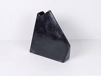 Front view of black geometric ceramic vase