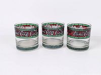 Front view of three Coca-Cola tumblers side by side