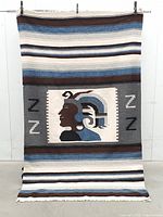 Full view of the woven Mexican blanket showing overall pattern and size