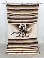 Full view of blanket hanging to show overall design, dimensions and condition
