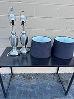 Both lamp bases and both shades on table