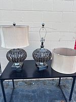 Both lamps with one shade removed showing bases and second shade condition