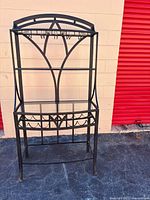 Full view of black metal and glass bar/wine rack