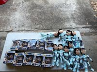 Tabletop view of all ten Funko Pop Toby Armored boxes and eleven Jim Lake plush dolls