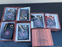 Six boxed retro turntable Bluetooth speakers, five black one red