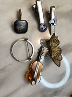 Front view of all six sterling items