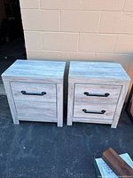 Front view of both nightstands showing finish, hardware, scuffs