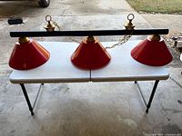 Full view of three-shade billiard light on table