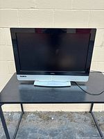 Front view of Vizio 32-inch TV on stand