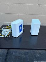 Both Wi-Fi gateways side by side with Ethernet cables