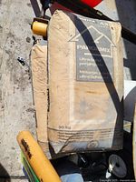 Two sealed dusty bags of Bomix Paragemix Ultra-Bond parging mix