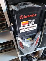 Front view of black/silver/red desktop PC tower with DVD Multi Recorder and automotive brand stickers