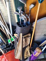Golf bag standing with visible clubs