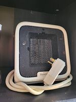 Front view of square Honeywell electric space heater with cord