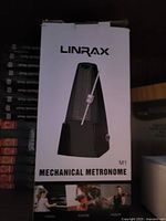 Box showing LINRAX M1 mechanical metronome image and branding