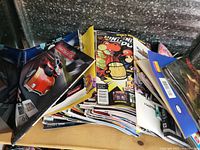 Pile of Nintendo Power magazines showing multiple stacked issues