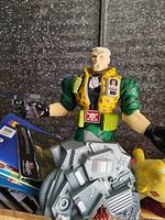 Front view of Major Chip Hazard figure holding pistol, standing for scale reference