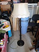Full view of lamp showing base, pole, shade and cord