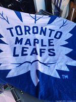 Blue and white fleece throw featuring Toronto Maple Leafs logo displayed fully