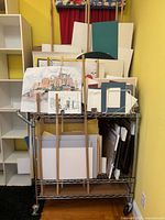 Front view of racks holding mat boards, foamcore, papers and artworks