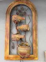 Full view of arched hanging fountain