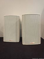 Front view of both white Klipsch KSB 1.1 speakers on dark surface