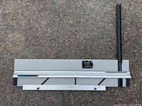 Full view of Logan Simplex Elite mat cutter showing rail, base, and measuring arm