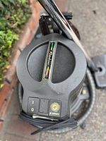 Top view of Rainbow E Series canister showing logo, controls and hose