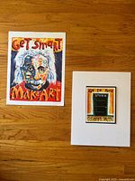 Both prints side by side on hardwood floor