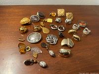 All jewellery pieces laid out on wood surface