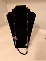 Full view of entire necklace on display bust