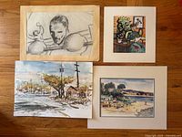 Overview of all four artworks laid out on floor