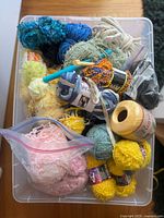 Top view of tote showing variety of yarn and tools