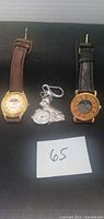 Three watches laid out: Gitano wristwatch, Westie keychain watch, gold-tone wristwatch