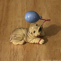 Front view of Shar Pei figurine showing balloon detail