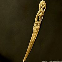 Full view of brass letter opener front side