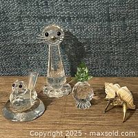 Four items together: tall seal, small seal ring holder, pineapple, shell with crab