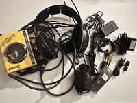 All items overview including Prosonic cassette player, headphones, adapters and cables